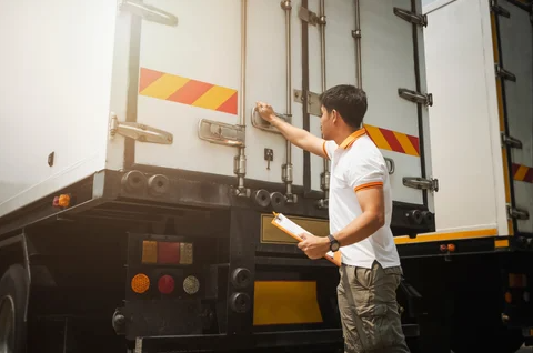 Man inspecting commercial trailer